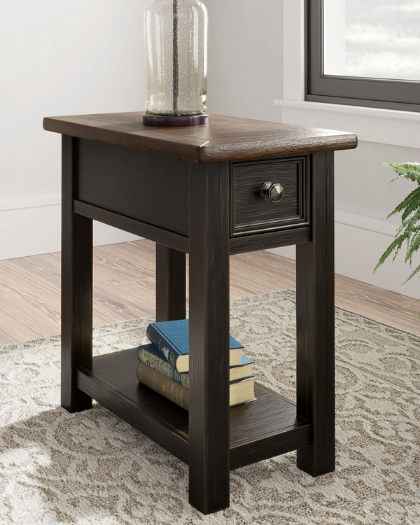 this rectangular chairside end table is sure to charm. Its two-tone aesthetic pairs a weathered grayish brown tabletop with a textured wire brushed base in black. A built-in shelf offers handy display space. And the tabl