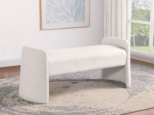  offering an interesting silhouette complete with rounded supports that extend upward to create arms. The bench is padded with foa