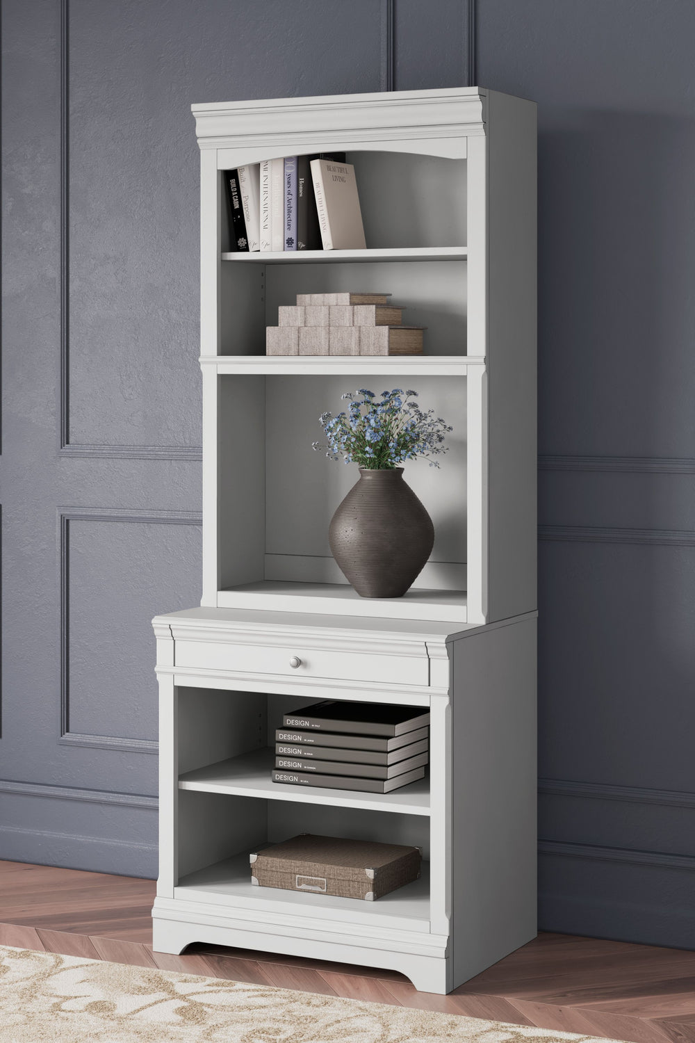 Make a style statement with this home office bookcase. Its traditional design is updated with an on-trend distressed whitewash finish. A hutch with LED underlighting shines a light on those elusive reading glasses and other desktop items. The bookshelf an