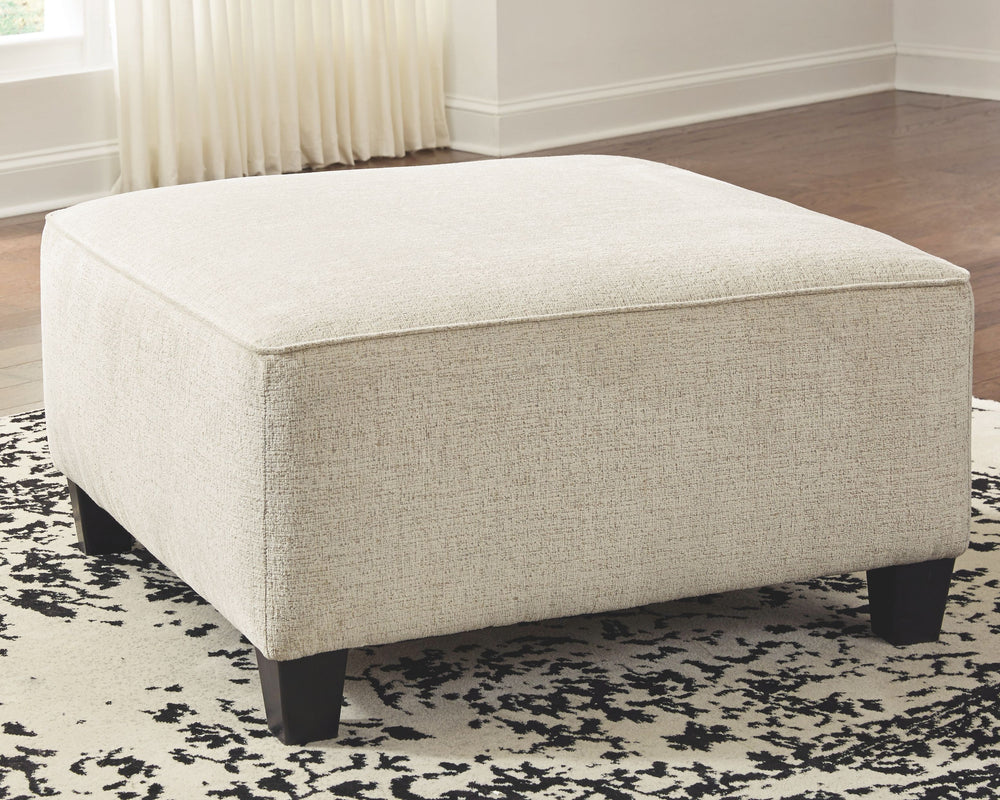 If youâ€™re looking to lighten the mood, youâ€™re sure to find this oversized ottoman a breath of fresh air. Covered in a cream chenille upholstery loaded with plush texture, this less-is-more contemporary ottoman is one sensational sidekick.<br><br><b>Ad