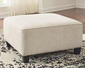 youâ€™re sure to find this oversized ottoman a breath of fresh air. Covered in a cream chenille upholstery loaded with plush texture