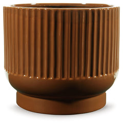 This ceramic vase makes a relaxed style statement. Its casual design and earthy burnt umber glaze complement your laid-back sensibilities. Delightfully simple and simply delightful, this vase subtly wows on its own or when filled with your favorite flower