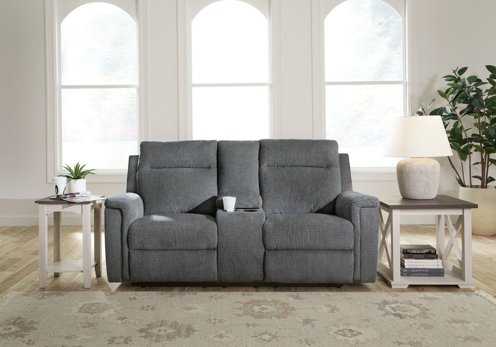 The ability to go from fully upright to relaxed and stretched out, all at the touch of a button, awaits. A beautiful blend of plush upholstery and casual style, this power reclining loveseat with console invites you to sink into ultimate comfort. Easily t
