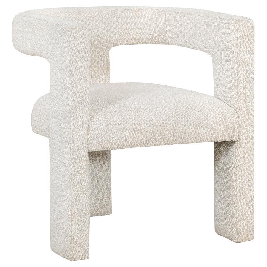 Enveloped entirely in the embrace of plush bouclÃ©, this chair redefines the art of relaxation with its all-fabric design. The seamless transition from the cushioned seat to the curved arms, all robed in the same soft fabric, creates a cocoon of comfort. 
