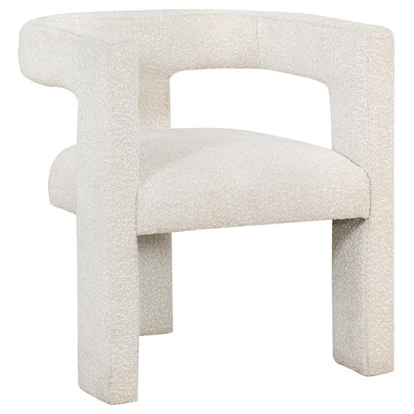 Enveloped entirely in the embrace of plush bouclÃ©, this chair redefines the art of relaxation with its all-fabric design. The seamless transition from the cushioned seat to the curved arms, all robed in the same soft fabric, creates a cocoon of comfort. 