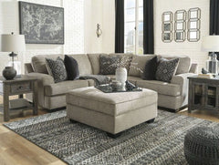 Whether your style is clean and contemporary or cozy modern farmhouse, this generously sized set in a stone-tone neutral upholstery has the corner on style. <h4><b>Bovarian - Stone - LAF Sofa w/Corner Wedge</b></h4> <table width=-"100%-"><colgroup><col st