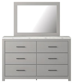 Cool, clean and casually modern. This dresser and mirrorâ€™s wispy dove gray finish and faux Calcutta marble top set the tone for your calming sanctuary. Large linear pulls add dimension and authenticity. Six smooth-gliding drawers neatly accommodate your