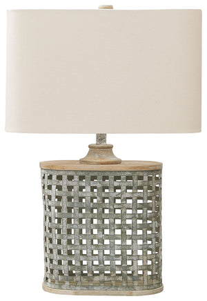 Whether your look is coolly contemporary or retro chic, this neutral table lamp simply delights. Its whitewashed finish over galvanized metal adds the perfect rustic refined tone. The shapely base, placed next to a sofa or beside a bed, rounds out the loo