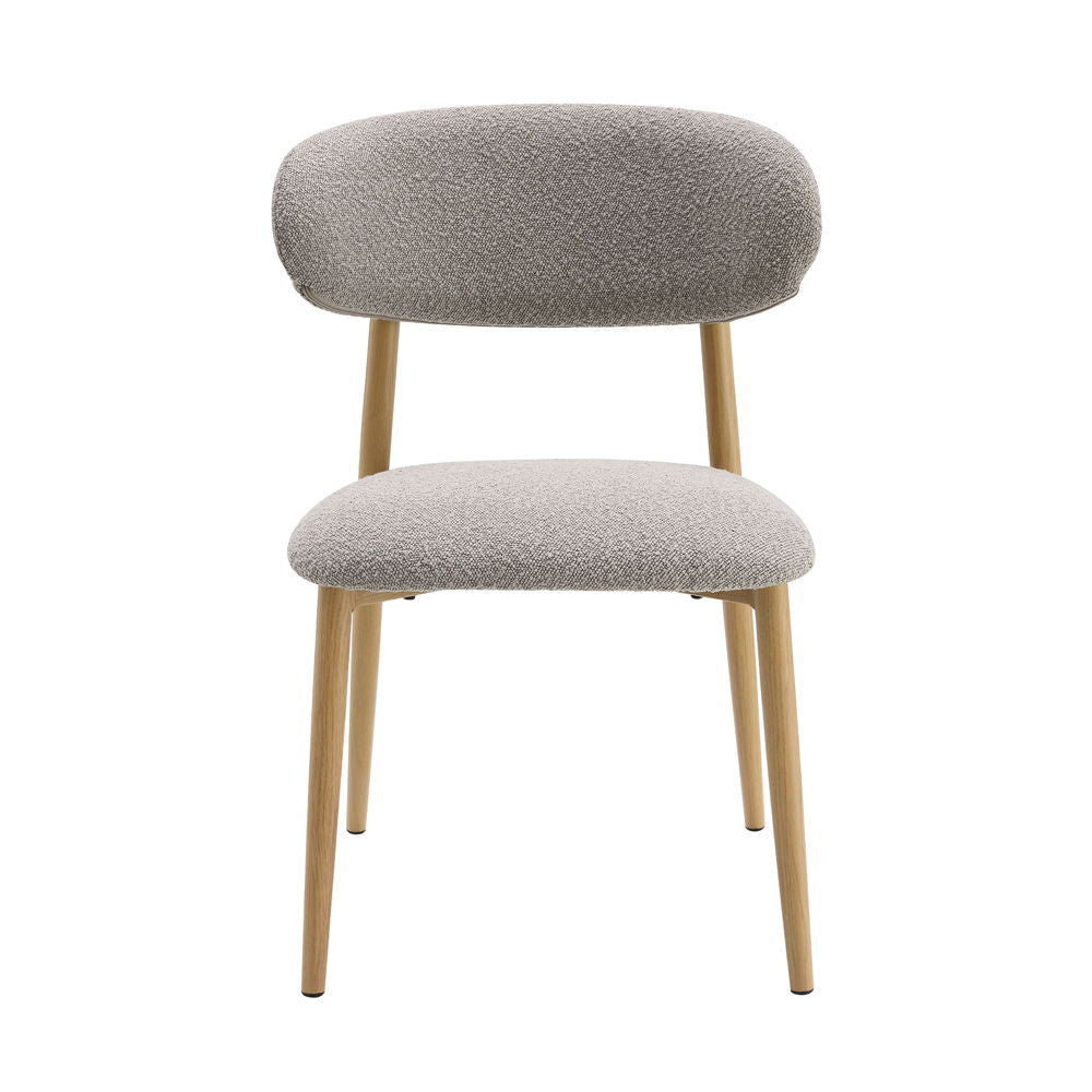 The Kacey dining set, with its elegant round wooden table top, exudes charm and sophistication. The marble grain finish adds a touch of luxury, while the single pedestal base ensures stability. Complemented by padded seat and back cushion side chairs, thi