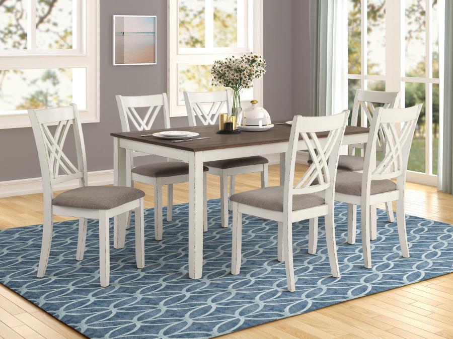 Complete your modern farmhouse dining room with this seven-piece dining set. Complete with one dining table and six side chairs, it offers a matching vintage white finish that lends a country charm. The spacious, rectangular dining table also features a c