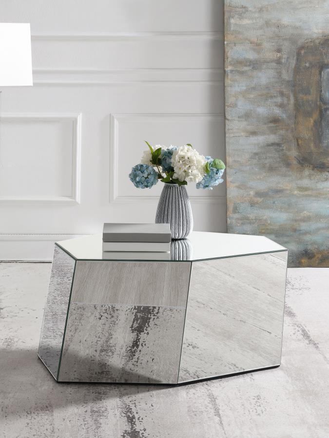 This mirrored coffee table combines a bold hexagonal silhouette with a geometric design, offering glamorous contemporary appeal. Irregular sides create visual depth, while mirrored surfaces add refined sophistication. Fully set up and ready to use, this t