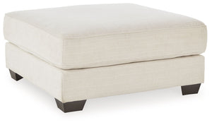 Delightfully modern. Exceptionally comfortable. If casually cool elegance is the look you-'re going for, this ottoman pleases in striking style. A plush top invites you to kick back and stay a while. Elevated in design, this companion piece is sure to be 