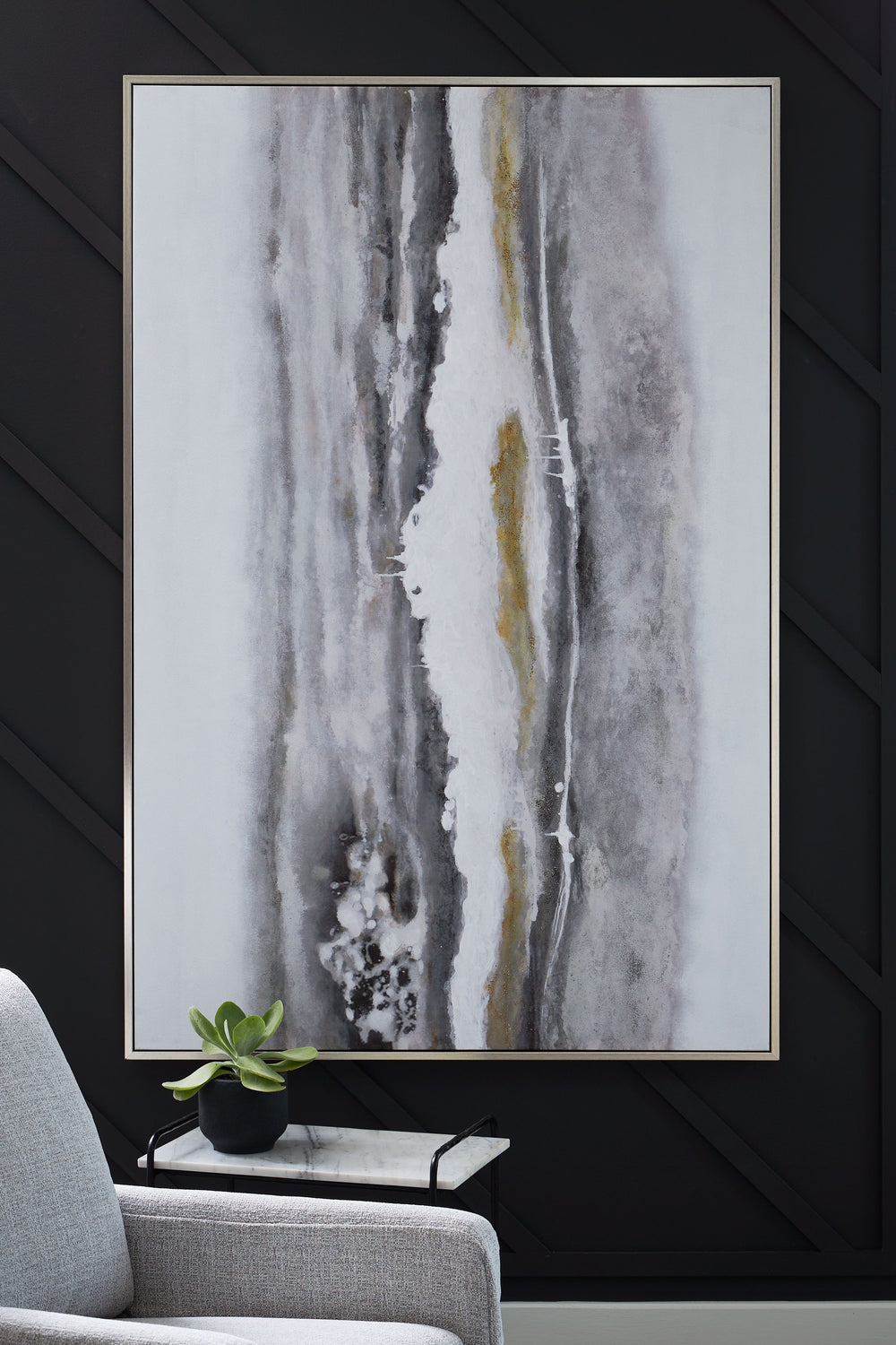 Chic as a statement piece or on a gallery wall, this wall art adds abstract flair to your decor. Its neutral hues and metallic touches have the versatility to pair with a variety of contemporary aesthetics. And when you need a fresh perspective, vertical 