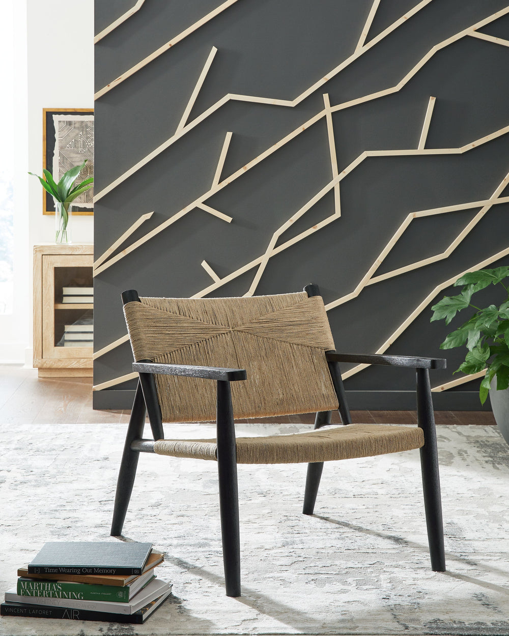 Understated style done beautifully well. This accent chair-'s natural jute upholstery offers a striking contrast with its black wood frame. Combining a contemporary aesthetic with a mid-century vibe, it-'s ideal for the living room or bedroom.<br><br><b>A