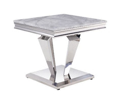 Contemporary flair breathes new life and interest into traditional design. The perfect combination of beauty and style features classic pedestal base topped with light grey marble. Updated modern touches are seen throughout the table base such as sleek, u