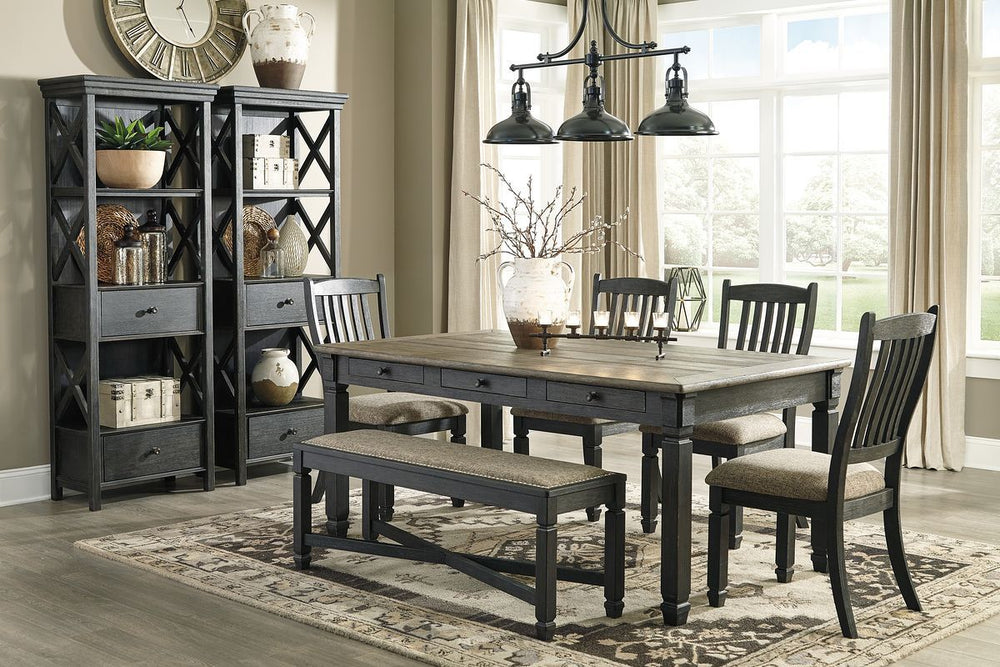Unique two-tone finish with a combination of Oak and Acacia substrates combining a trendy textured antique black color with table and server tops finished in a textural weathered oak finish. Rectangular dining table features six convenient drawers for sto