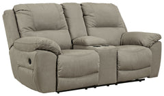 Kick back, relax, and enjoy some sports on TV with this reclining loveseat. You will love its double stuffed pillow top arms and soft-as-suede faux leather upholstery. The family-friendly dark gray color and creative stitching add panache. Recline in comf