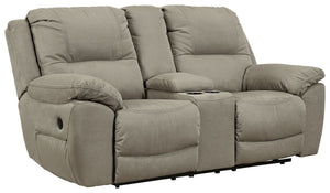 Kick back, relax, and enjoy some sports on TV with this reclining loveseat. You will love its double stuffed pillow top arms and soft-as-suede faux leather upholstery. The family-friendly dark gray color and creative stitching add panache. Recline in comf