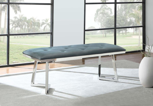  it offers a soft and inviting seat. The polished stainless steel base boasts a striking angular frame