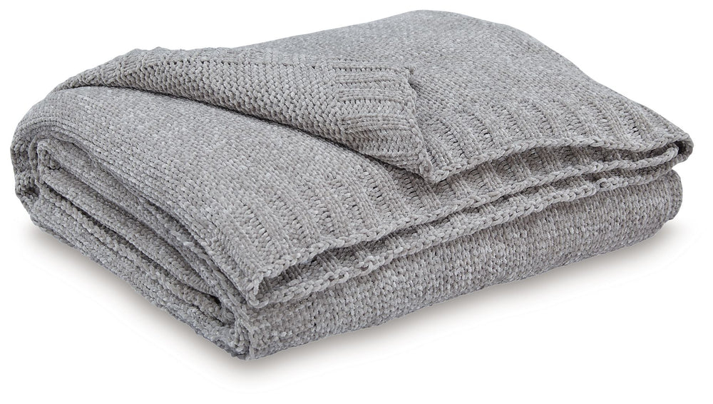 Comfort meets casually chic style in this throw blanket. Its neutral hue and knitted construction create trendy textural variation when draped over a sofa or the foot of a bed. And it goes beyond style, with the soft chenille fabric acting as a cozy compa