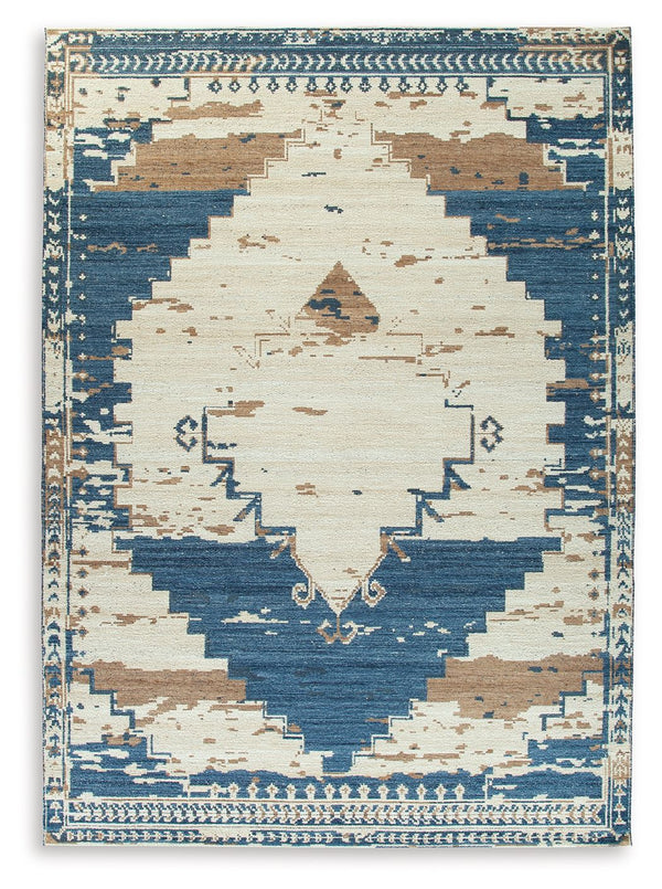 Invite a casual boho vibe into your space. Showcasing a distressed medallion design, this rug can mix and match with other accents to curate an eclectic aesthetic. Its blue, brown and tan palette exudes a relaxed feel, completing your living room or bedro