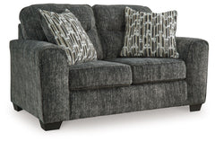 This loveseat speaks to those drawn to fresh, contemporary style with richly neutral appeal. Subtle and sophisticated, the plush upholstery and dark tri-block legs are a natural complement for so many color schemes. Two accent pillows make the seating eve