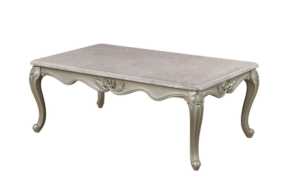 The Monique Royal Classic Cocktail Table in champagne epitomizes heirloom-quality craftsmanship and timeless elegance. Expertly constructed from premium pine solids and adorned with durable polyurethane carvings, this coffee table is lightweight, moisture