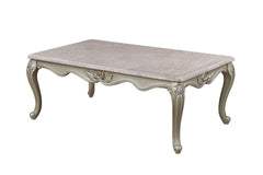 The Monique Royal Classic Cocktail Table in champagne epitomizes heirloom-quality craftsmanship and timeless elegance. Expertly constructed from premium pine solids and adorned with durable polyurethane carvings, this coffee table is lightweight, moisture