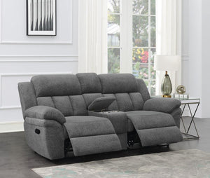  creating a stylish addition to your living room or den. Between the recliners is a center storage console wi