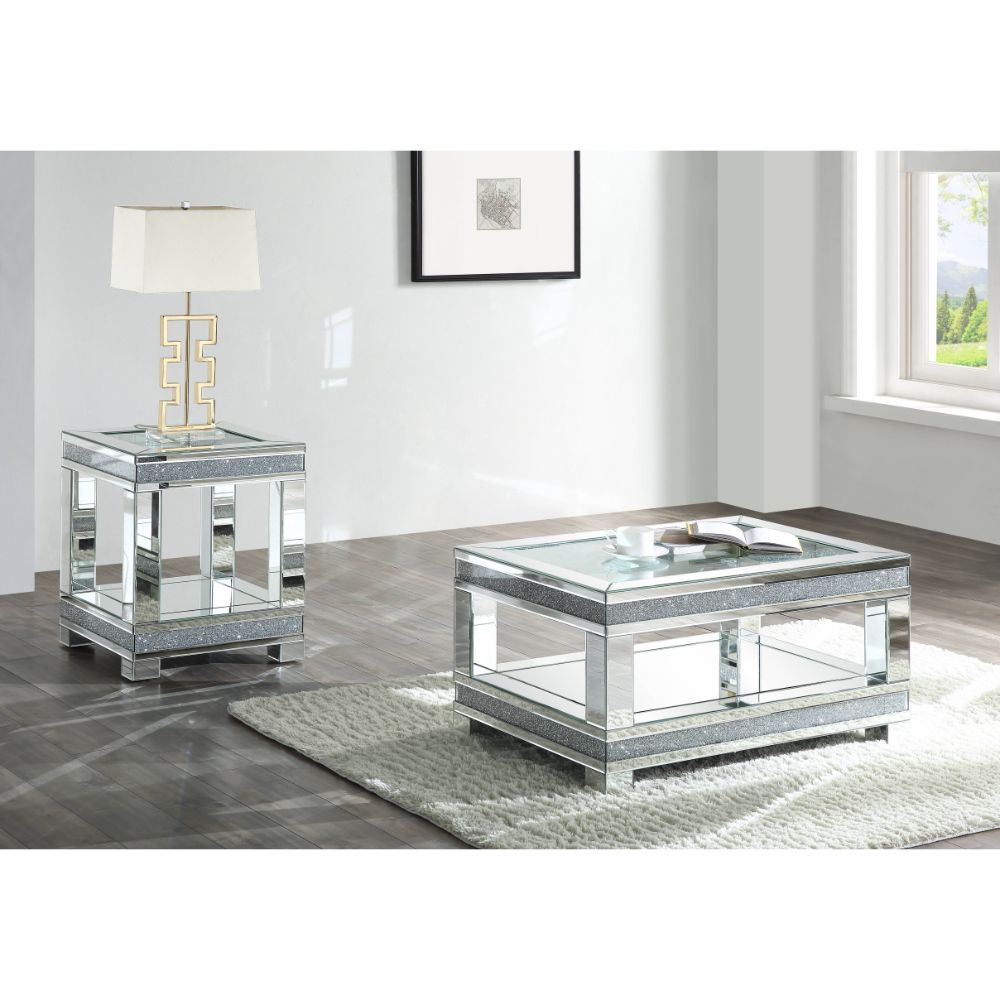 Add sparkle into your life with this striking Noralie mirrored and faux diamonds coffee table. The clear tempered glass top is as beautiful as it is sturdy. The large surface area gives you room for displaying your reading materials or other collectibles.
