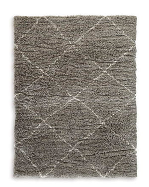 When is a rug more than a rug? When it invites you to kick off your shoes and stay a while. This shag rug welcomes visitors with warmth and a tantalizingly thick, plush pile. Its neutral color palette exudes a casually cool vibe that works wonders whereve