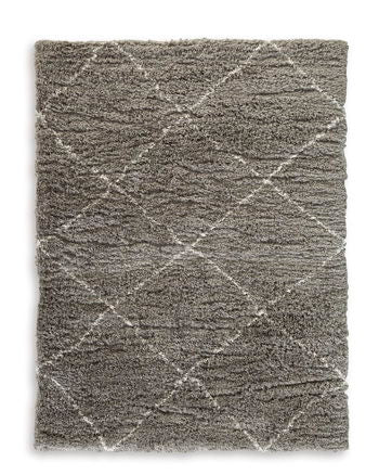 When is a rug more than a rug? When it invites you to kick off your shoes and stay a while. This shag rug welcomes visitors with warmth and a tantalizingly thick, plush pile. Its neutral color palette exudes a casually cool vibe that works wonders whereve