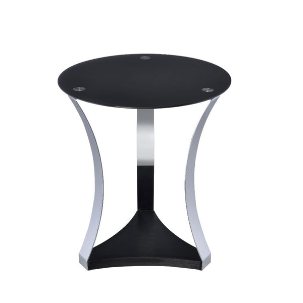 The Geiger coffee table expresses modern design and simplicity while still being functional and a conversation table. It features soft curved metal legs supporting a black glass top and a reverse cut base. The bottom wooden shelf gives you additional spac