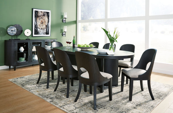 Contemporary lifestyle design. Made of hardwood solids and ash veneer. Rich layered black finish on textured wood grain surface. Collection is inspired by Art Deco designs with trend-right curved silhouettes. Table features an oval design and architectura