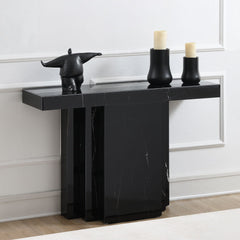 Drisana collection console table and accent mirror exudes modern elegance with its sleek black mirrored finish and marble grain design. This sophisticated pair adds a touch of luxury to any entryway or living space, providing both style and functionality.