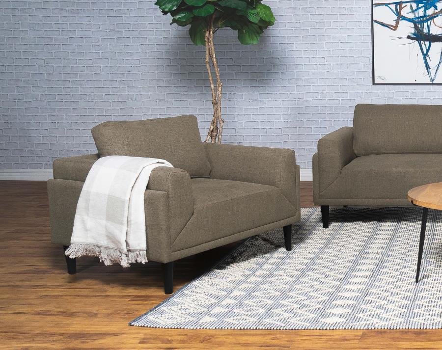 Unveiling our modern chair, where innovation meets elegance in a frame within a frame design. Adorned in a chic fabric, its streamlined silhouette is highlighted by meticulous topstitch details and track arms complemented by mitered front accents. Priorit