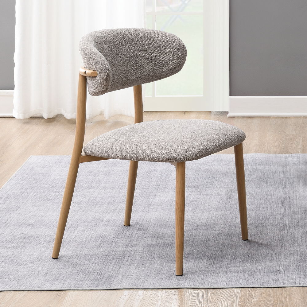 The Kacey dining set, with its elegant round wooden table top, exudes charm and sophistication. The marble grain finish adds a touch of luxury, while the single pedestal base ensures stability. Complemented by padded seat and back cushion side chairs, thi