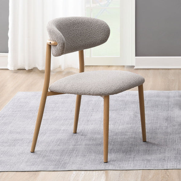 The Kacey dining set, with its elegant round wooden table top, exudes charm and sophistication. The marble grain finish adds a touch of luxury, while the single pedestal base ensures stability. Complemented by padded seat and back cushion side chairs, thi
