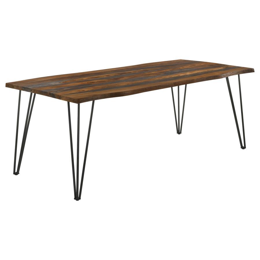 Create a casual dining experience with this rustic industrial dining table, designed with a spacious sheesham wood tabletop in a grey finish and natural live-edge details. Retro-inspired hairpin metal legs in a bold gunmetal finish lend an industrial touc