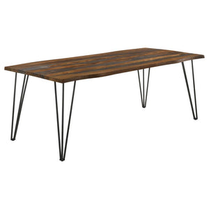 Create a casual dining experience with this rustic industrial dining table, designed with a spacious sheesham wood tabletop in a grey finish and natural live-edge details. Retro-inspired hairpin metal legs in a bold gunmetal finish lend an industrial touc