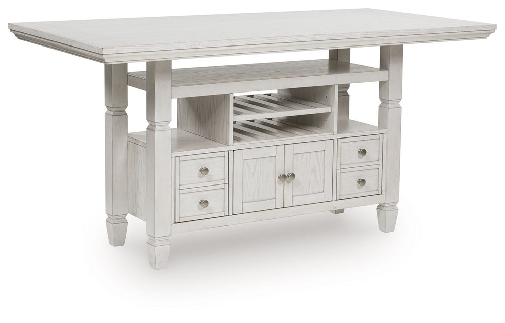 This counter height dining table brings an air of casual charm to mealtime. With its antiqued white finish, farmhouse-style dining has never been so fashionable. And this curated approach to everyday function is loaded with storage options, from cabinets 