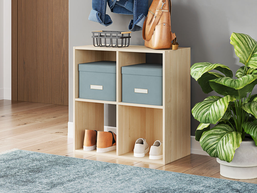 Keep clutter out from underfoot with this four-cube organizer. The natural finish over replicated ash wood grain is warm and inviting, all while keeping your toys, knickknacks and other items stored away. The perfect marriage of style and function, this o