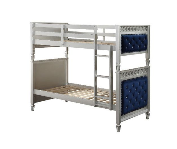 Fulfill your children-'s dreams of being royalty with this Varian twin over twin bunk bed and trundle. With elegant details such as a silver finish, button-tufted velvet upholstered headboard and footboard panels, and beautifully tapered legs, all add to 