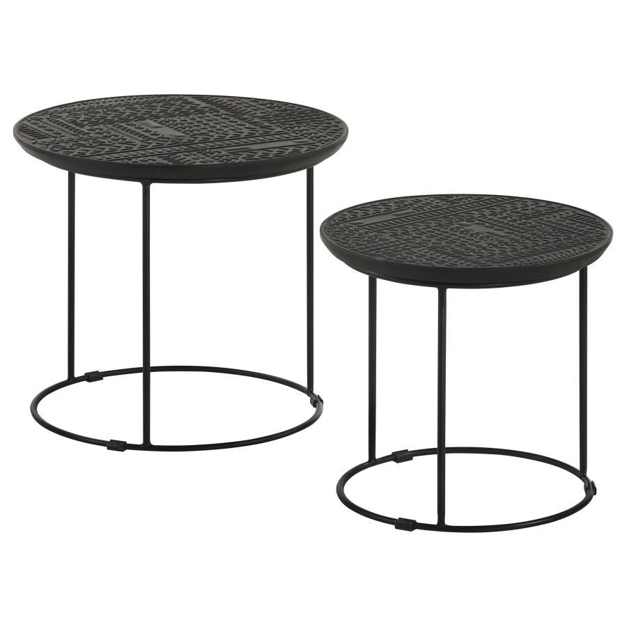 Add a modern rustic touch to your space with this two-piece nesting table set, designed for style and function. Crafted from eco-friendly solid mango wood, the embossed tribal-inspired ink blot pattern on the round tabletops adds a textured global aesthet