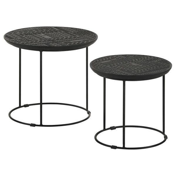 Add a modern rustic touch to your space with this two-piece nesting table set, designed for style and function. Crafted from eco-friendly solid mango wood, the embossed tribal-inspired ink blot pattern on the round tabletops adds a textured global aesthet