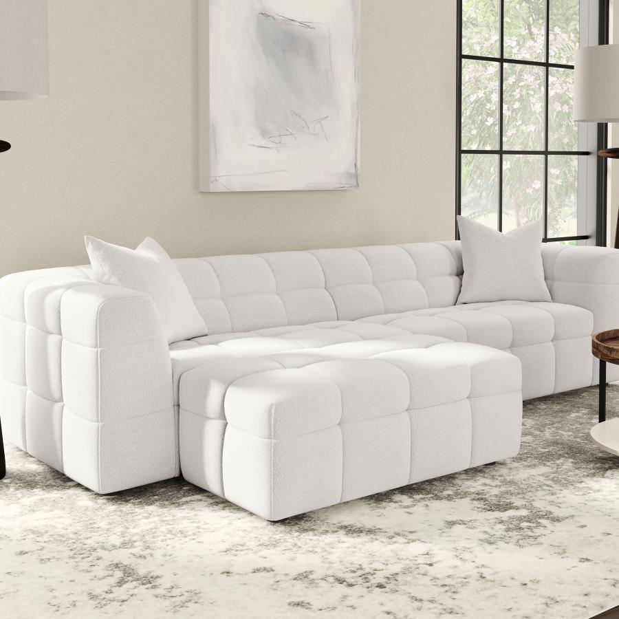 Enhance your lounging comfort with the versatile and functional ottoman. Designed to provide added leg support, this ottoman can be used as extra seating or a convenient footrest. Wrapped in soft textured boucle upholstery, it offers a plush and luxurious