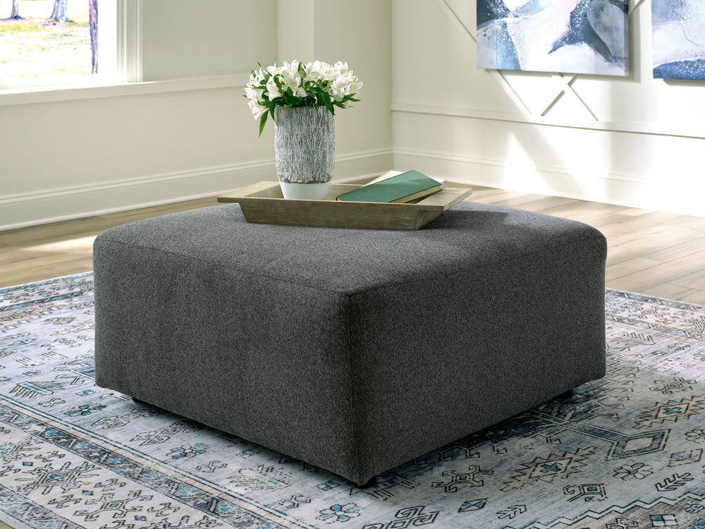 Contemporary fashion, meet superior form. This ottoman is strikingly streamlined in design, with its handsome charcoal upholstery speaking to tried-and-true modern color palettes. Kick back, relax and settle into the calm of your curated space.<br><br><b>