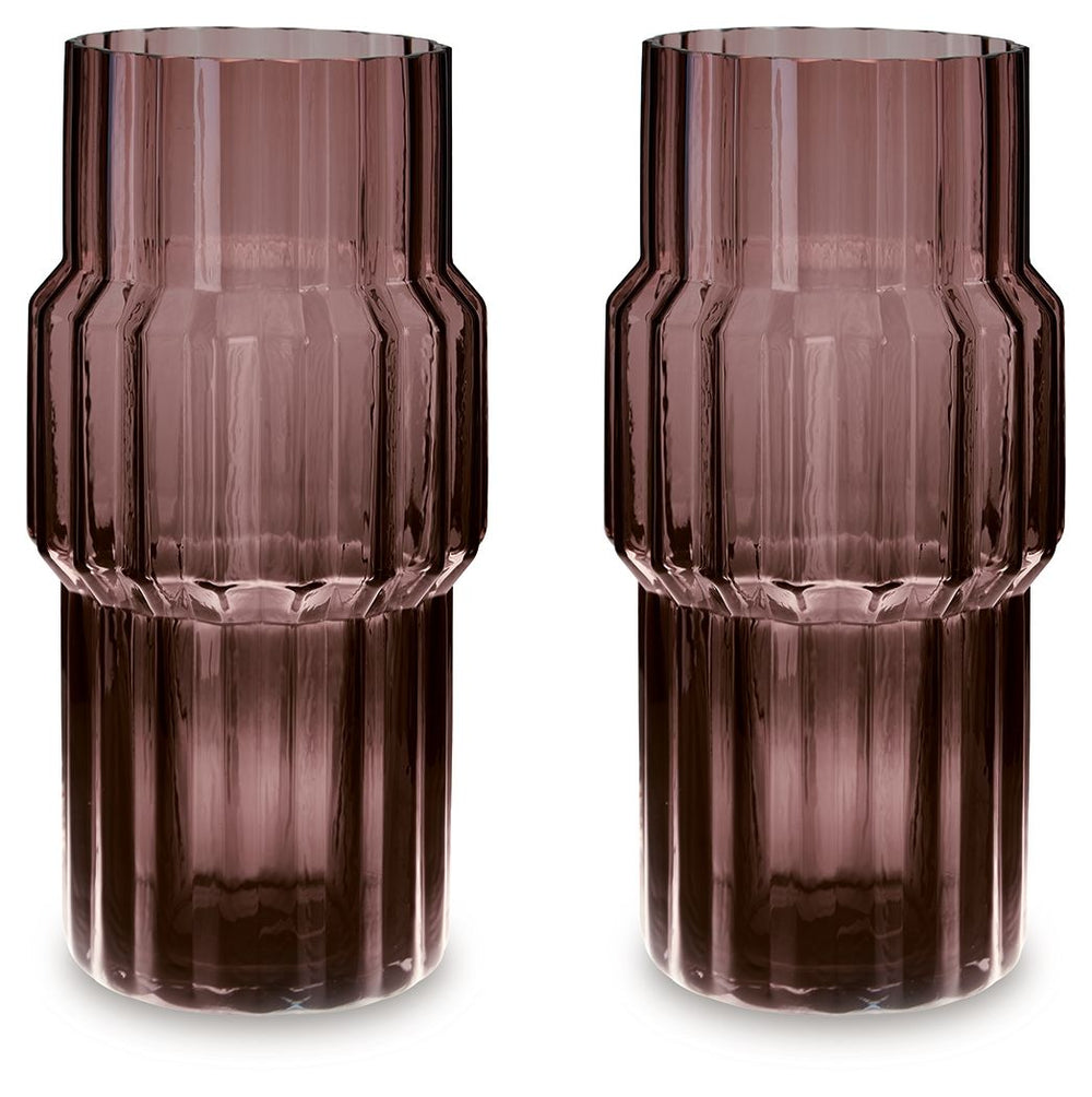 This vase, made of dark mauve-tinted glass, adds a captivating touch to indoor or outdoor decor. Its unique textured shape and oversized fluted details create an elegant art piece. Whether it-'s accentuating flowers or candlelight, this vase is simply str