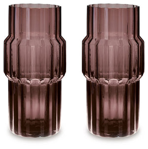 This vase, made of dark mauve-tinted glass, adds a captivating touch to indoor or outdoor decor. Its unique textured shape and oversized fluted details create an elegant art piece. Whether it-'s accentuating flowers or candlelight, this vase is simply str