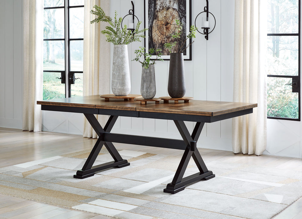 Raise the bar on modern farmhouse style with this dining extension table. Its handsome good looks are accentuated with a two-tone finish and a casual butcher block veneer top. The sturdy silhouette adds a hearty element, whether your style is vintage, cou